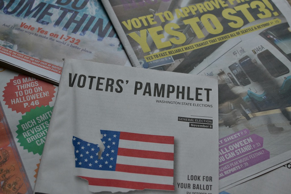 Voter's Pamphlet and newspapers